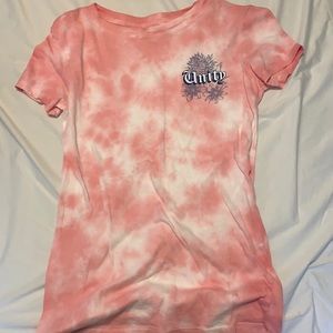 Pink shirt with “unity” word on front